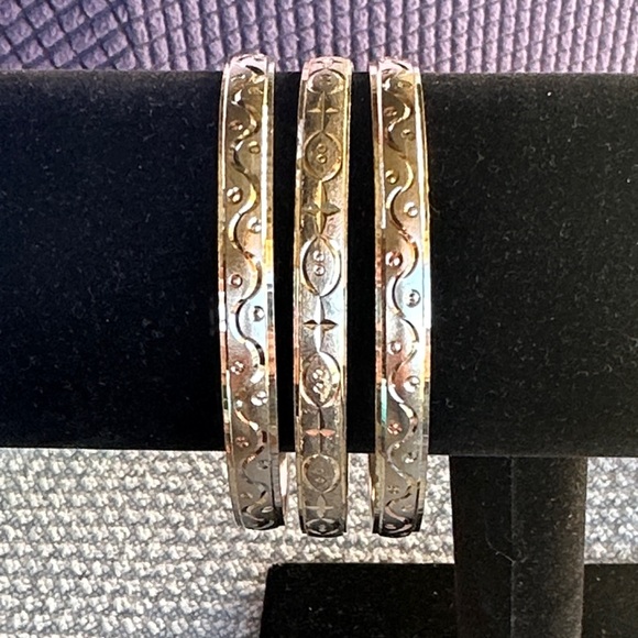 Jewelry - Goldtone Bangle Bracelet Trio. Brushed Goldtone with etched Bohemian style